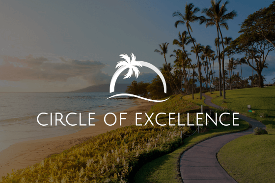 Beach scene with Circle of Excellence logo