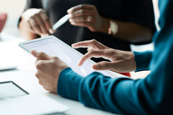 Business person using tablet to show functionality of Cetera technologies