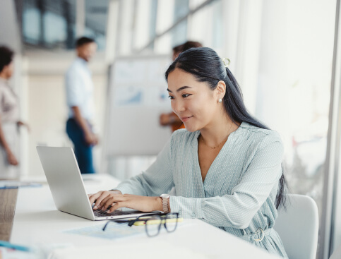 Business woman using a laptop to work on digital marketing
